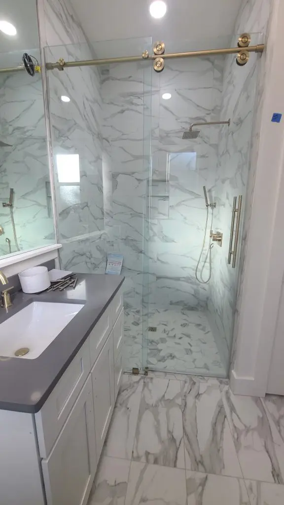 Glass shower with brass hardware