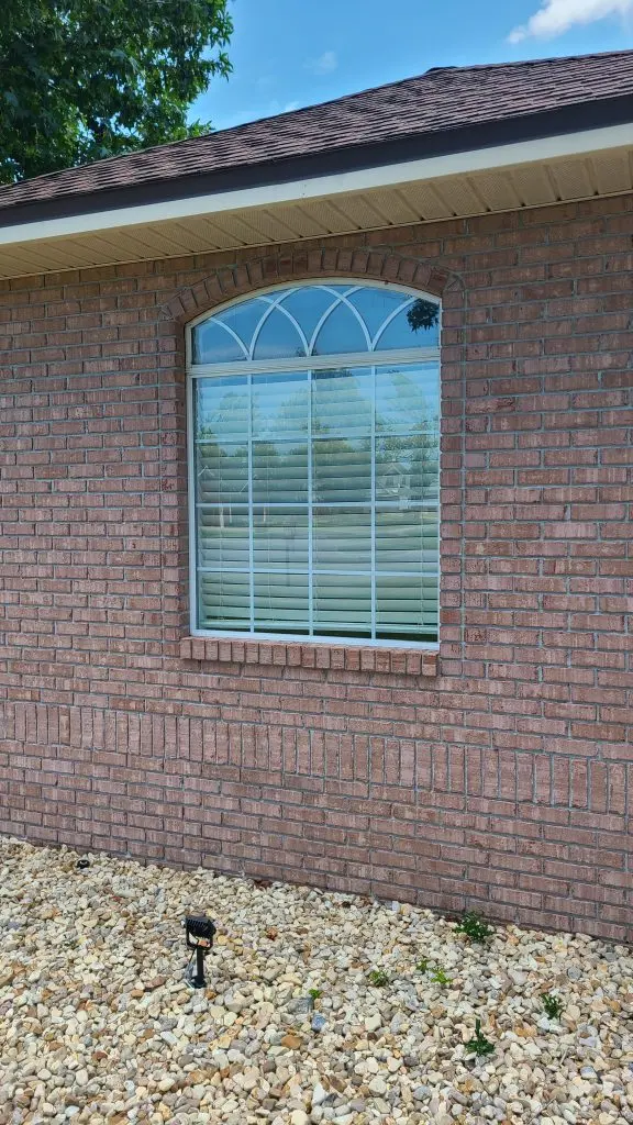 Arched window on a brick home