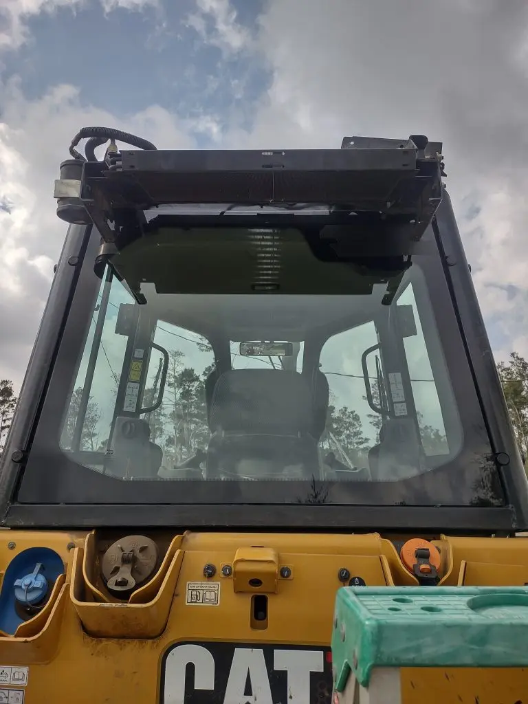 Glass on a CAT heavy equipment cab